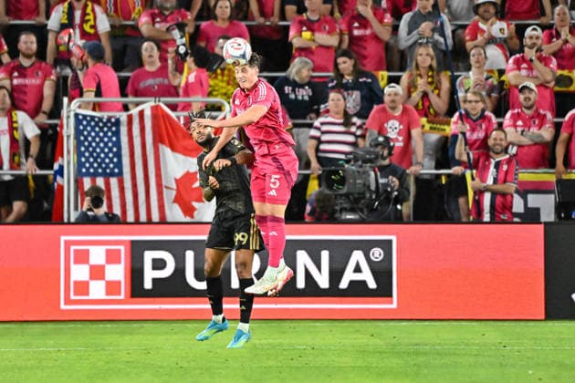 ST. LOUIS, MO - MAY 13: Lukas MacNaughton (5) of the St. Louis CITY SC leaps in front of Denis Bouanga (99) of the Los Angeles Football Club to head the ball out of danger during the MLS, Fussball Herren, USA regular season match where St. Louis CITY SC hosted Los Angeles Football Club on Wednesday May 13th, 2026, at Energizer Park in St. Louis City, MO. (Photo by Rick Ulreich Icon Sportswire) SOCCER: MAY 13 MLS St. Louis CITY SC vs Los Angeles Football Club EDITORIAL USE ONLY Icon26051340