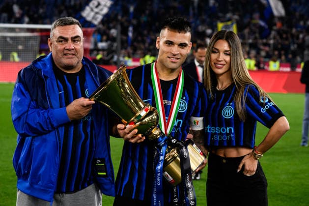 Lautaro Martinez of FC Internazionale (c) celebrates with his father Mario (l) and his wife Agustina Gandolfo kisses the trophy as he celebrates at the end of the 2025 2026 Coppa Italia football final between SS Lazio and FC Internazionale at Stadio Olimpico in Rome (Italy), May 13, 2026. AndreaxStaccioli