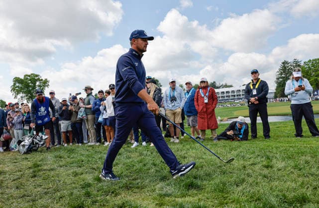 Bryson DeChambeau walks to his ball in the rough on the 17th hole during the first round of the 2026 PGA, Golf Herren Championship at Aronimink Golf Club in Newtown Square, Pennsylvania, on Thursday, May 14, 2026.  PHI20260514858 LAURENCExKESTERSON
