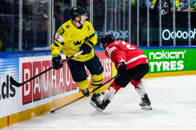 260515 Lucas Raymond of Sweden and Dylan Demelo of Canada during the 2026 IIHF Ice hockey, Eishockey World Championship, WM, Weltmeisterschaft match between Canada and Sweden on May 15, 2026 in Fribourg. Photo: Jesper Zerman BILDBYRAN kod JZ JZ0714 ishockey ice hockey ishockey-vm 2026 vm 2026 iihf world championship kanada canada sverige sweden bbeng Copyright: JESPERxZERMAN BB260515BB165