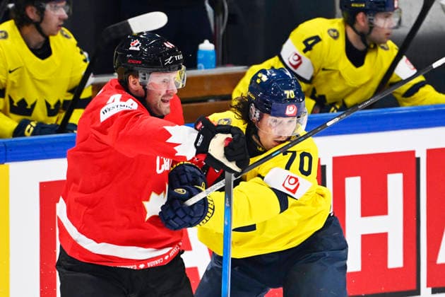 FRIBOURG, SWITZERLAND 20260515 Canada s Morgan Rielly against Sweden s Oskar Sundqvist during the opening match of the Ice hockey, Eishockey World Championship, WM, Weltmeisterschaft between Canada and Sweden at BCF Arena, Fribourg, Switzerland.
