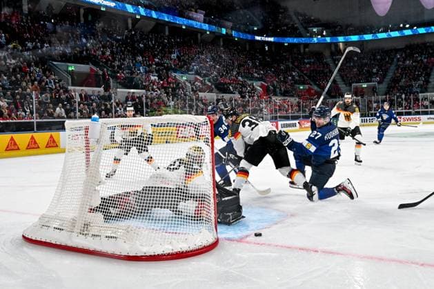 ZURICH, SWITZERLAND - MAY 15: Janne Kuokkanen of Finland R) tries to score against goalkeeper Philipp Grubauer of Germany during the 2026 IIHF Ice hockey, Eishockey World Championship, WM, Weltmeisterschaft Switzerland game between Finland and Germany at Swiss Life Arena on May 15, 2026 in Zurich, Zurich. Zurich Swiss Life Arena Zurich Switzerland Copyright: xJustPictures.ch AndreaxBrancax jp-en-EuSpIm-JP7_ANB_Fin_Ger_15052026_1119