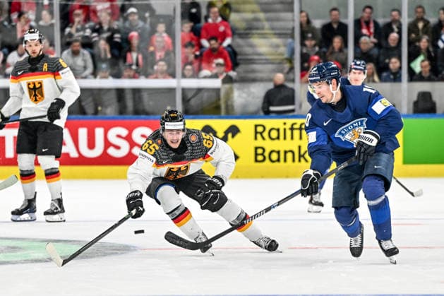 ZURICH, SWITZERLAND - MAY 15: Henri Jokiharju of Finland plays the puck chased by Marc Michaelis of Germany during the 2026 IIHF Ice hockey, Eishockey World Championship, WM, Weltmeisterschaft Switzerland game between Finland and Germany at Swiss Life Arena on May 15, 2026 in Zurich, Zurich. Zurich Swiss Life Arena Zurich Switzerland Copyright: xJustPictures.ch AndreaxBrancax jp-en-EuSpIm-JP7_ANB_Fin_Ger_15052026_8753