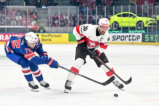 ZURICH, SWITZERLAND - MAY 15: Roman Josi of Switzerland protects the puck from Connor Clifton of United States during the 2026 IIHF Ice hockey, Eishockey World Championship, WM, Weltmeisterschaft Switzerland game between USA and Switzerland at Swiss Life Arena on May 15, 2026 in Zurich, Zurich. Zurich Swiss Life Arena Zurich Switzerland Copyright: xJustPictures.ch AndreaxBrancax jp-en-EuSpIm-JP7_ANB_US_Sui_15052026_9317