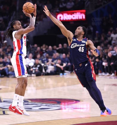 Detroit Pistons Daniss Jenkins (24) shoots a three over Cleveland Cavaliers Donovan Mitchell (45) in the fourth quarter in Cleveland, Ohio Friday May 15, 2026. The Pistons Defeated the Cavaliers 115-94.  CLE20260515113 AARONxJOSEFCZYK
