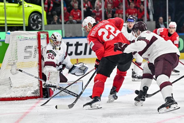 ZURICH, SWITZERLAND - MAY 16: Nino Niederreiter of Switzerland in action against goalkeeper Kristers Gudlevskis of Latvia during the 2026 IIHF Ice hockey, Eishockey World Championship, WM, Weltmeisterschaft Switzerland game between Switzerland and Latvia at Swiss Life Arena on May 16, 2026 in Zurich, Zurich. Zurich Swiss Life Arena Zurich Switzerland Copyright: xJustPictures.ch AndreaxBrancax jp-en-EuSpIm-JP7_ANB_Sui_Lat_16052026_4723