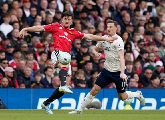 Manchester, England, 17th May 2026. Harry Maguire of Manchester United, ManU tussles with Chris Wood of Nottingham Forest during the Manchester United vs Nottingham Forest Premier League match at Old Trafford, Manchester. Picture credit should read: Andrew Yates Sportimage EDITORIAL USE ONLY. No use with unauthorised audio, video, data, fixture lists, club league logos or live services. Online in-match use limited to 120 images, no video emulation. No use in betting, games or single club league player publications. SPI_036_AY_Man_Utd_Forest SPI-4806-0037