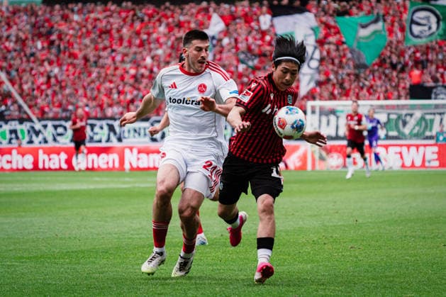 2. Bundesliga: Hannover 96 vs. 1. FC Nürnberg, 17.05.2026 Luka Lochoshvili (1. FC Nürnberg, 24) gegen Daisuke Yokota (Hannover 96, 18) im Zweikampf; Fußball, 2. Bundesliga, 34. Spieltag: Hannover 96 vs. 1. FC Nürnberg am 17.05.2026 in der Heinz von Heiden Arena, Hannover DFL REGULATIONS PROHIBIT ANY USE OF PHOTOGRAPHS AS IMAGE SEQUENCES AND OR QUASI-VIDEO. Copyright: xBEAUTIFULxSPORTS Tonhäuserx