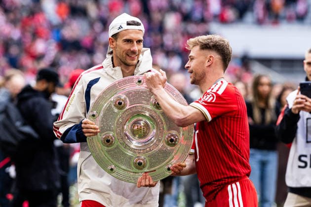 MUNICH, GERMANY - MAY 16: Joshua Kimmich (FC Bayern Muenchen, 6) giving the trophy to Leon Goretzka (FC Bayern Muenchen, 8) after the Bundesliga match between FC Bayern Muenchen vs. 1. FC Koeln at Allianz Arena on matchday 34 of the 1. Bundesliga on May 16, 2026 in Munich, Germany. DFL REGULATIONS PROHIBIT ANY USE OF PHOTOGRAPHS AS IMAGE SEQUENCES AND OR QUASI-VIDEO. Bavaria Germany Copyright: xSteffiexWunderlx