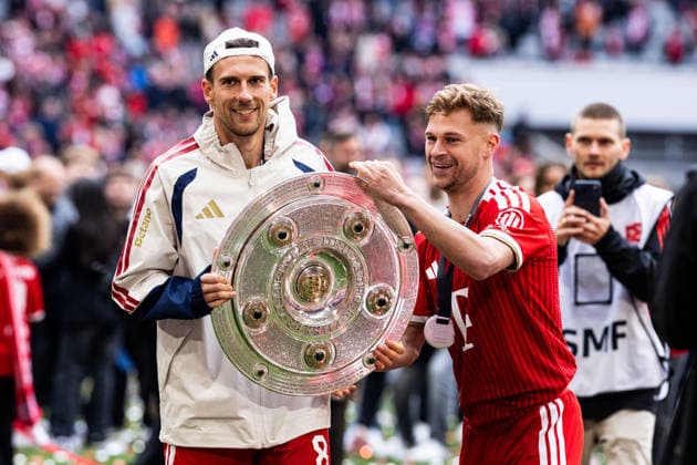 MUNICH, GERMANY - MAY 16: Joshua Kimmich (FC Bayern Muenchen, 6) giving the trophy to Leon Goretzka (FC Bayern Muenchen, 8) after the Bundesliga match between FC Bayern Muenchen vs. 1. FC Koeln at Allianz Arena on matchday 34 of the 1. Bundesliga on May 16, 2026 in Munich, Germany. DFL REGULATIONS PROHIBIT ANY USE OF PHOTOGRAPHS AS IMAGE SEQUENCES AND OR QUASI-VIDEO. Bavaria Germany Copyright: xSteffiexWunderlx