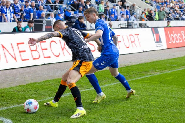 Deutschland: 2.Bundesliga, 34. Spieltag, Saison 2025 2026, 1.FC Magdeburg vs 1. FC Kaiserslautern Avnet Arena (Magdeburg) : Wekesser Erik (1. FC Kaiserslautern, 13) im Zweikampf gegen Hercher Philipp (1. FC Magdeburg, 27) Copyright: xMichellexLukax