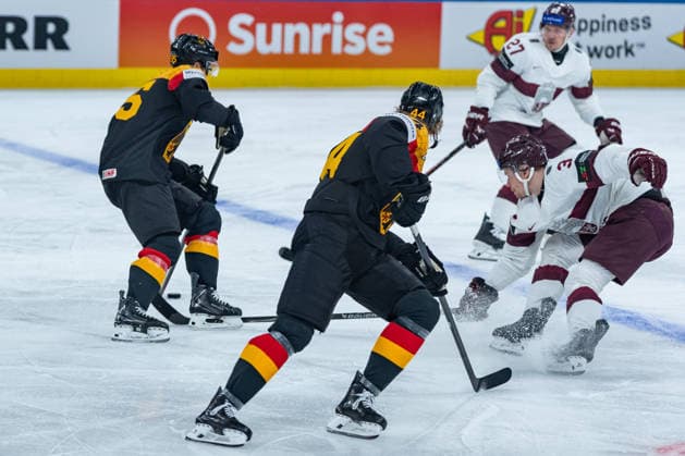 ZURICH, SWITZERLAND - MAY 17: Frederick Tiffels (Germany, 95) in the battle for the puck with Alberts Smits (Latvia, 3) during the Preliminary Round - Group A Match 15 between Germany and Latvia at the IIHF Ice hockey, Eishockey World Championship, WM, Weltmeisterschaft 2026, Swiss Life Arena on May 17, 2026 in Zurich, Switzerland. Zurich Switzerland Copyright: xTimoxSteinx