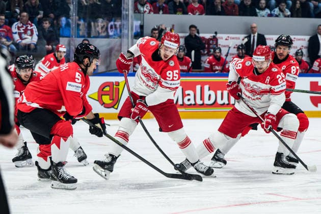 260518 Denton Mateychuk of Canada and Nick Olesen of Denmark during the 2026 IIHF Ice hockey, Eishockey World Championship, WM, Weltmeisterschaft match between Canada and Denmark on May 18, 2026 in Fribourg. Photo: Jesper Zerman BILDBYRAN kod JZ JZ0718 ishockey ice hockey ishockey-vm 2026 vm 2026 iihf world championship kanada canada danmark denmark canada kanada bbeng danmark denmark Copyright: JESPERxZERMAN BB260518JZ073