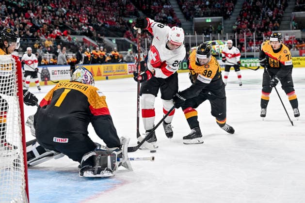 ZURICH, SWITZERLAND - MAY 18: Timo Meier of Switzerland in action against Fabio Wagner of Germany R) and goalkeeper Jonas Stettmer of Germany L) during the 2026 IIHF Ice hockey, Eishockey World Championship, WM, Weltmeisterschaft Switzerland game between Germany and Switzerland at Swiss Life Arena on May 18, 2026 in Zurich, Zurich. Zurich Swiss Life Arena Zurich Switzerland Copyright: xJustPictures.ch AndreaxBrancax jp-en-EuSpIm-JP7_ANB_Ger_Sui_18052026_1860