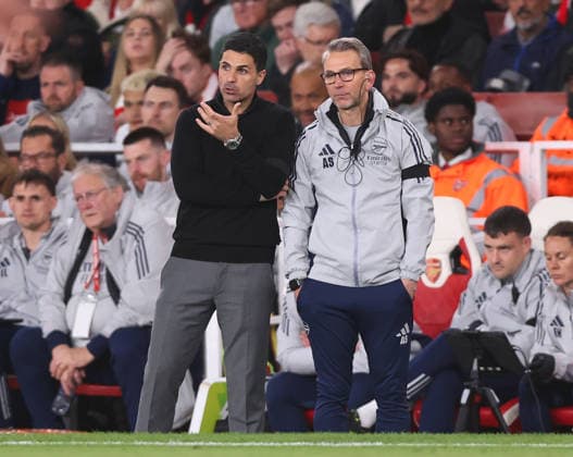 London, England, 18th May 2026. Mikel Arteta manager of Arsenal talks to assistant Albert Stuivenberg during the Arsenal vs Burnley Premier League match at the Emirates Stadium, London. Picture credit should read: David Klein Sportimage EDITORIAL USE ONLY. No use with unauthorised audio, video, data, fixture lists, club league logos or live services. Online in-match use limited to 120 images, no video emulation. No use in betting, games or single club league player publications. SPI_021_DK_Arsenal_Burnley SPI-4808-0019