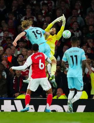 Zian Flemming of Burnley is booked for this challange on Arsenal Goalkeeper David Raya Arsenal v Burnley, Premier League, Football, Emirates Stadium, London, UK - 18 May 2026London Emirates Stadium United Kingdom EDITORIAL USE ONLY No use with unauthorised audio, video, data, fixture lists, club league logos or live services. Online in-match use limited to 120 images, no video emulation. No use in betting, games or single club league player publications. Copyright: xJavierxGarcia Shutterstockx 16881286ae