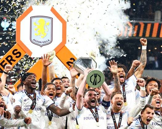 Aston Villa players lift the UEFA Europa League trophy in front of the winners board SC Freiburg v Aston Villa, UEFA Europa League, Final, Football, Besiktas Park, Istanbul, Turkiye - 20 May 2026Istanbul Besiktas Park United Kingdom EDITORIAL USE ONLY No use with unauthorised audio, video, data, fixture lists, club league logos or live services. Online in-match use limited to 120 images, no video emulation. No use in betting, games or single club league player publications.  Copyright: xJamesxMarsh Shutterstockx 16883157ga