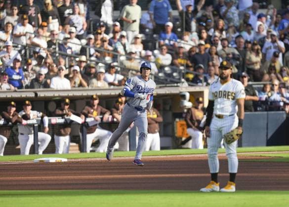 Baseball: Dodgers vs. Padres Los Angeles Dodgers two-way player Shohei Ohtani rounds the bases after hitting a solo home run as San Diego Padres second baseman Fernando Tatis Jr. looks on in the first inning of a baseball game against the at Petco Park in San Diego, California, on May 20, 2026.  A14AA0005592395P