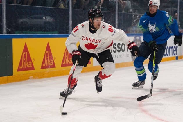 FRIBOURG, FRIBOURG - MAY 22: Dylan Holloway of Canada battles with Aljosa Crnovic of Slovenia during the 2026 IIHF World Championship, WM, Weltmeisterschaft Preliminary Round Group B match between Canada and Slovenia at BCF Arena on May 22, 2026 in Fribourg, Fribourg, Switzerland. Copyright: xLivioxBaeriswylx xSPPx Sportspressphoto_SPR151774