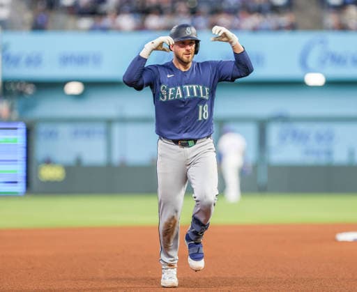 MAY 22, 2026: Seattle Mariners catcher Mitch Garver (18) celebrates at third base after hitting a home run against the Kansas City Royals at Kauffman Stadium in Kansas City, MO. CSM Kansas City United States - ZUMAc04_ 20260522_zma_c04_079 Copyright: xRomanxPunox