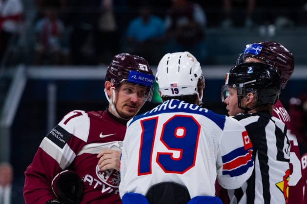 ZURICH, SWITZERLAND - MAY 23: Matthew Tkachuk (United States, 19) and Oskars Cibulskis (Latvia, 27) discussing during the Preliminary Round - Group A Match 37 between Latvia and United States at the IIHF Ice hockey, Eishockey World Championship, WM, Weltmeisterschaft 2026, Swiss Life Arena on May 23, 2026 in Zurich, Switzerland. Zurich Switzerland Copyright: xTimoxSteinx