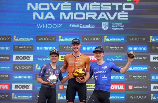 World Cup cross country mountain bike shorttrack men s race, Vysocina Arena, Nove Mesto na Morave, May 23, 2026. The second placed Tom Pidcock from the United Kingdom, from left, winner Mathis Azzaro from France and the third placed Dario Lillo from Switzerland. (CTKxPhoto LiborxPlihal) CTKPhotoP2026052303406  CTKPhotoP2026052303406