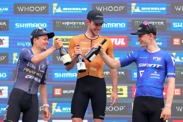 World Cup cross country mountain bike shorttrack men s race, Vysocina Arena, Nove Mesto na Morave, May 23, 2026. The second placed Tom Pidcock from the United Kingdom, from left, winner Mathis Azzaro from France and the third placed Dario Lillo from Switzerland. (CTKxPhoto LiborxPlihal) CTKPhotoP2026052303424  CTKPhotoP2026052303424