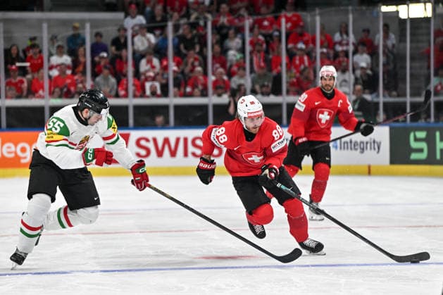 ZURICH, SWITZERLAND - MAY 23: Christoph Bertschy of Switzerland in action against Tamas Ortenszky of Hungary during the 2026 IIHF Ice hockey, Eishockey World Championship, WM, Weltmeisterschaft Switzerland game between Switzerland and Hungary at Swiss Life Arena on May 23, 2026 in Zurich, Zurich. Zurich Swiss Life Arena Zurich Switzerland Copyright: xJustPictures.ch AndreaxBrancax jp-en-EuSpIm-JP7_ANB_Sui_Hung_23052026_2767