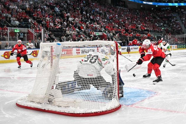ZURICH, SWITZERLAND - MAY 23: Attilio Biasca of Switzerland tries to score against goalkeeper Adam Vay of Hungary during the 2026 IIHF Ice hockey, Eishockey World Championship, WM, Weltmeisterschaft Switzerland game between Switzerland and Hungary at Swiss Life Arena on May 23, 2026 in Zurich, Zurich. Zurich Swiss Life Arena Zurich Switzerland Copyright: xJustPictures.ch AndreaxBrancax jp-en-EuSpIm-JP7_ANB_Sui_Hung_23052026_0813