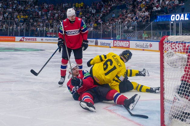 FRIBOURG, SWITZERLAND - MAY 23: Viggo Bjorck of Sweden fall over Max Krogdahl of Norway during the 2026 IIHF Ice hockey, Eishockey World Championship, WM, Weltmeisterschaft Switzerland game between Norway and Sweden at BCF Arena on May 23, 2026 in Fribourg, Fribourg. Fribourg BCF Arena Fribourg Switzerland Copyright: xJustPictures.ch JarixPestelaccix jp-en-EuSpIm-JP6_JAR_Norway_Sweden_23May2026_00052