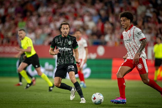 Axel Witsel (Girona FC) and Marc Aguado (Elche CF) in action during a La Liga EA Sports match between Girona FC and Elche CF at Estadi Municipal de Montilivi in Girona, , Spain, on May 23 2026. Photo by Felipe Mondino Copyright: x@FELIPExMONDINOx