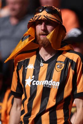 Hull City v Middlesbrough - Sky Bet Championship Final 23 May 2026, London - SkyBet Championship Play-Off Final - Hull City v Middlesbrough - A Hull City fan fashions protection from the sun with a flag - Photo: Charlotte Wilson Offside. London England United Kingdom Copyright: xCharlottexWilson OffsidexOffside 776497548
