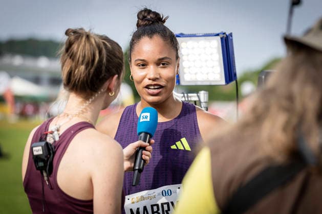 REHLINGEN , GERMANY - MAY 24: Yemisi Mabry (GER MTG Mannheim) interviewed by Katrin Schmidt of SR during the 61. Internationales Pfingstsportfest on 24.05.2026 at the Bungertstadion in Rehlingen-Siersburg (Saarland Deutschland). Saarland Deutschland Copyright: xLeahxKohringx