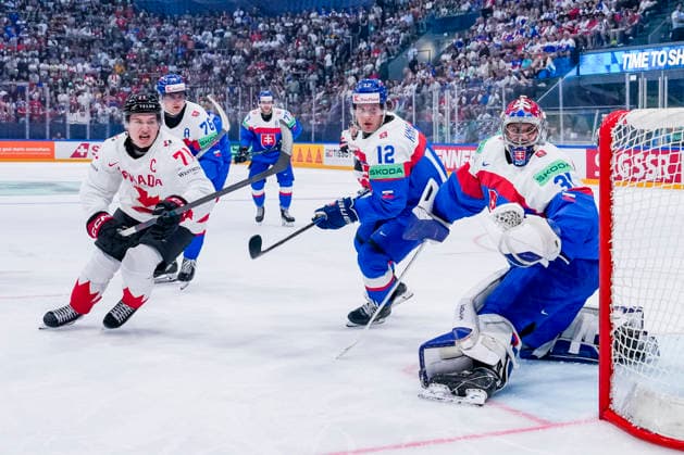 FRIBOURG, SWITZERLAND - MAY 24: Macklin Celebrini of Canada L) against Samuel Knazko of Slovakia C) and goalkeeper Samuel Hlavaj of Slovakia R) during the 2026 IIHF Ice hockey, Eishockey World Championship, WM, Weltmeisterschaft Switzerland game between Slovakia and Canada at BCF Arena on May 24, 2026 in Fribourg, Fribourg. Fribourg BCF Arena Fribourg Switzerland Copyright: xJustPictures.ch JarixPestelaccix jp-en-EuSpIm-JP6_JAR_Slovakia_Canada_24May2026_00037