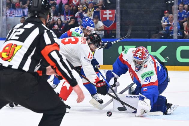 L-R Marek Hrivik (SVK), Gabriel Vilardi (CAN) and goalkeeper Samuel Hlavaj in action during to the group B match of the World Ice hockey, Eishockey Championship, Slovakia - Canada, Fribourg, Switzerland, on May 24, 2026. (CTKxPhoto RadekxPetrasek) CTKPhotoP2026052406822  CTKPhotoP2026052406822