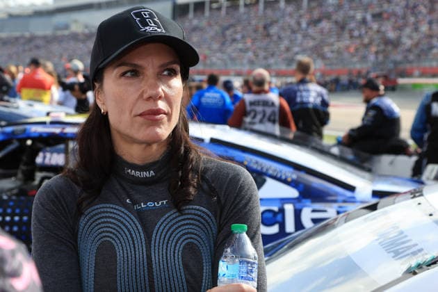 CHARLOTTE, NC - MAY 24: Katherine Legge ( 78 Live Fast Motorsports e.l.f. Cosmetics Chevrolet) talks with a member of her race team while wearing a hat honoring the late Kyle Busch prior to the running of the NASCAR, Motorsport, USA Cup Series Coca-Cola 600 on May 24, 2026 at Charlotte Motor Speedway in Charlotte, NC. (Photo by Jeff Robinson Icon Sportswire) AUTO: MAY 24 NASCAR Cup Series Coca-Cola 600 EDITORIAL USE ONLY Icon2605246884600