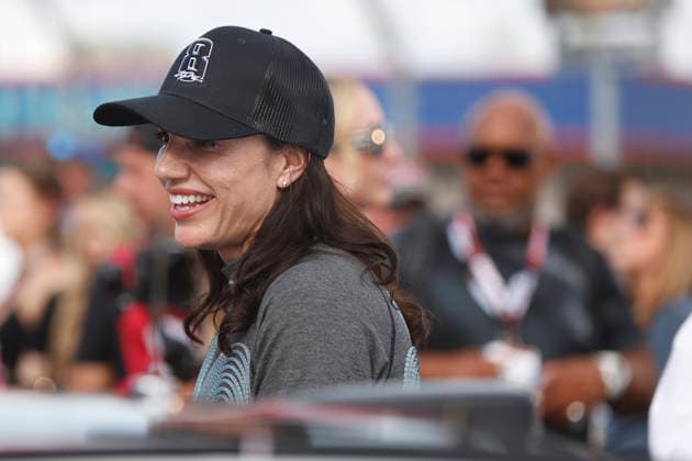 CHARLOTTE, NC - MAY 24: Katherine Legge ( 78 Live Fast Motorsports e.l.f. Cosmetics Chevrolet) talks with a member of her race team while wearing a hat honoring the late Kyle Busch prior to the running of the NASCAR, Motorsport, USA Cup Series Coca-Cola 600 on May 24, 2026 at Charlotte Motor Speedway in Charlotte, NC. (Photo by Jeff Robinson Icon Sportswire) AUTO: MAY 24 NASCAR Cup Series Coca-Cola 600 EDITORIAL USE ONLY Icon2605247894600