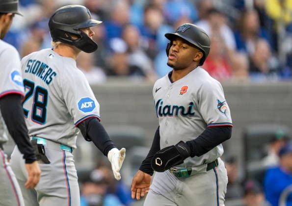 May 25, 2026, Toronto, On, CAN: Miami Marlins Xavier Edwards (9) is congratulated by Kyle Stowers (28) after scoring on the Toronto Blue Jays during first inning MLB, Baseball Herren, USA action in Toronto on Monday May 25, 2026. Canada News - May 25, 2026  - ZUMAc35_ 20260525_zaf_c35_165 Copyright: xFrankxGunnx