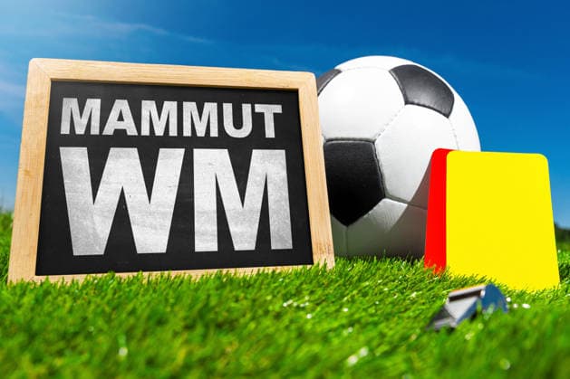 Germany - May 22, 2026: PHOTO MONTAGE. The words Mammoth World Cup next to a soccer ball and referee cards symbolize the enormous scale of the 2026 World Cup, featuring 48 teams, 104 matches, and three host countries.