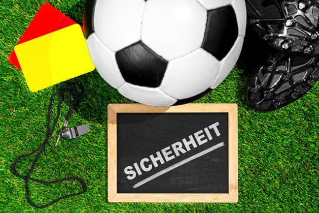Germany - May 22, 2026: PHOTO MONTAGE: Soccer cleats, a ball, and referee gear symbolize security concepts for the 2026 World Cup and highlight measures to protect players, fans, and events.