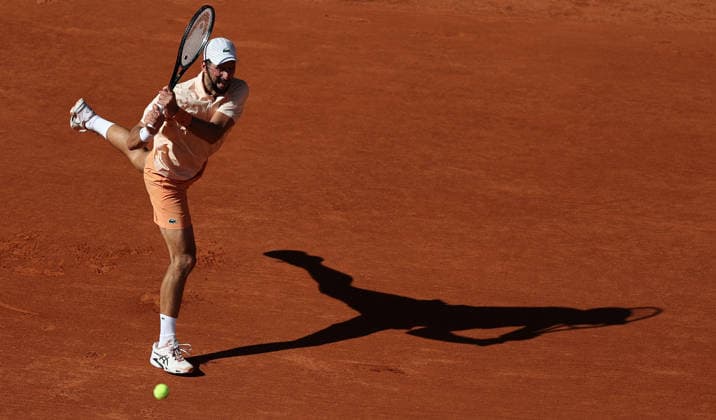 (260527) -- PARIS, May 27, 2026 -- Novak Djokovic hits a return during the men s singles second round match between Novak Djokovic of Serbia and Valentin Royer of France at the French Open tennis tournament at Roland Garros, Paris, France, May 27, 2026. ) (SP)FRANCE-PARIS-TENNIS-FRENCH OPEN-MEN S SINGLES-2ND ROUND-NOVAK DJOKOVIC VS VALENTIN ROYER WuxHuiwo