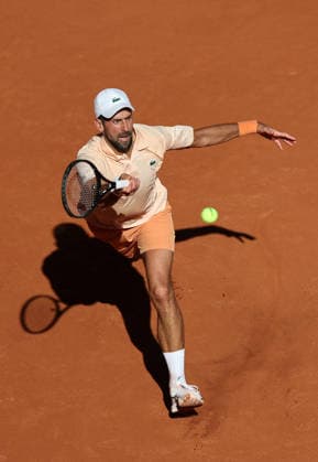 (260527) -- PARIS, May 27, 2026 -- Novak Djokovic hits a return during the men s singles second round match between Novak Djokovic of Serbia and Valentin Royer of France at the French Open tennis tournament at Roland Garros, Paris, France, May 27, 2026. ) (SP)FRANCE-PARIS-TENNIS-FRENCH OPEN-MEN S SINGLES-2ND ROUND-NOVAK DJOKOVIC VS VALENTIN ROYER WuxHuiwo