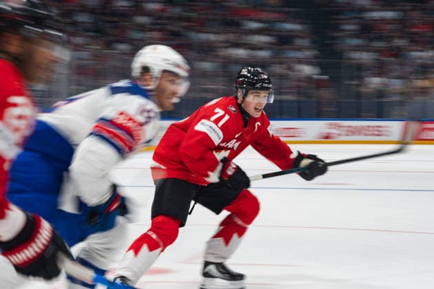 FRIBOURG, FRIBOURG - MAY 28: Macklin Celebrini of Canada attempts to break away during the 2026 IIHF World Championship, WM, Weltmeisterschaft quarterfinal match between Canada and the United States at BCF Arena on May 28, 2026 in Fribourg, Fribourg, Switzerland. Copyright: xLivioxBaeriswylx xSPPx Sportspressphoto_SPR156148