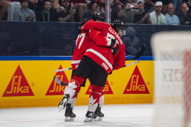 FRIBOURG, FRIBOURG - MAY 28: Sidney Crosby and Macklin Celebrini of Canada celebrate a goal during the 2026 IIHF World Championship, WM, Weltmeisterschaft quarterfinal match between Canada and the United States at BCF Arena on May 28, 2026 in Fribourg, Fribourg, Switzerland. Copyright: xLivioxBaeriswylx xSPPx Sportspressphoto_SPR156193