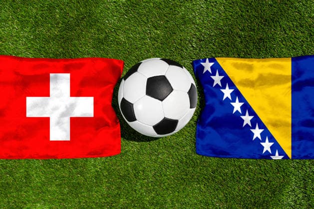 May 22, 2026: PHOTO MONTAGE, 2026 FIFA World Cup, WM, Weltmeisterschaft, Fussball National flags of Switzerland and Bosnia and Herzegovina with a soccer ball on the field. Illustrative image for the group stage match on June 18 at the 2026 FIFA World Cup