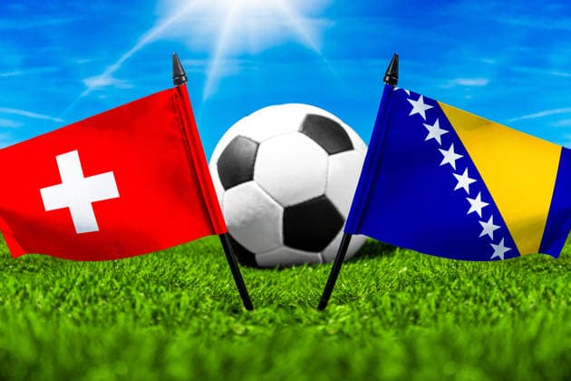 May 22, 2026: PHOTO MONTAGE, 2026 FIFA World Cup, WM, Weltmeisterschaft, Fussball National flags of Switzerland and Bosnia and Herzegovina with a soccer ball on the field. Illustrative image for the group stage match on June 18 at the 2026 FIFA World Cup