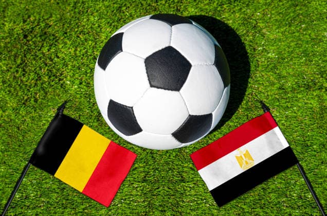 May 22, 2026: PHOTO MONTAGE, 2026 FIFA World Cup, WM, Weltmeisterschaft, Fussball National flags of Belgium and Egypt with a soccer ball on the field. Stock image for the group stage match on June 15 at the 2026 FIFA World Cup