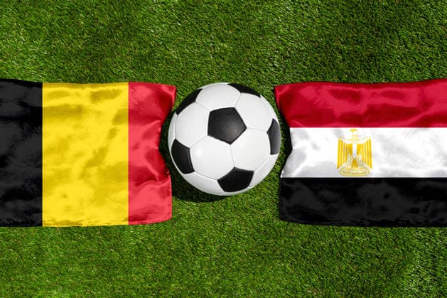 May 22, 2026: PHOTO MONTAGE, 2026 FIFA World Cup, WM, Weltmeisterschaft, Fussball National flags of Belgium and Egypt with a soccer ball on the field. Stock image for the group stage match on June 15 at the 2026 FIFA World Cup