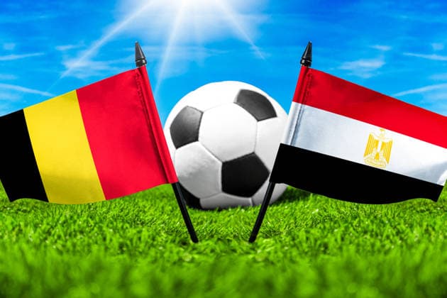 May 22, 2026: PHOTO MONTAGE, 2026 FIFA World Cup, WM, Weltmeisterschaft, Fussball National flags of Belgium and Egypt with a soccer ball on the field. Stock image for the group stage match on June 15 at the 2026 FIFA World Cup