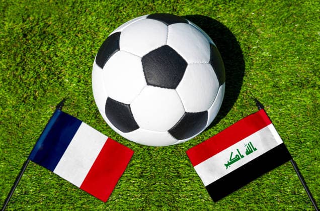 May 22, 2026: PHOTO MONTAGE, 2026 FIFA World Cup, WM, Weltmeisterschaft, Fussball National flags of France and Iraq with a soccer ball on the field. Stock image for the group stage match on June 22 at the 2026 FIFA World Cup
